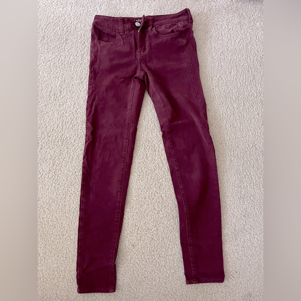 Dark maroon skinny jeans